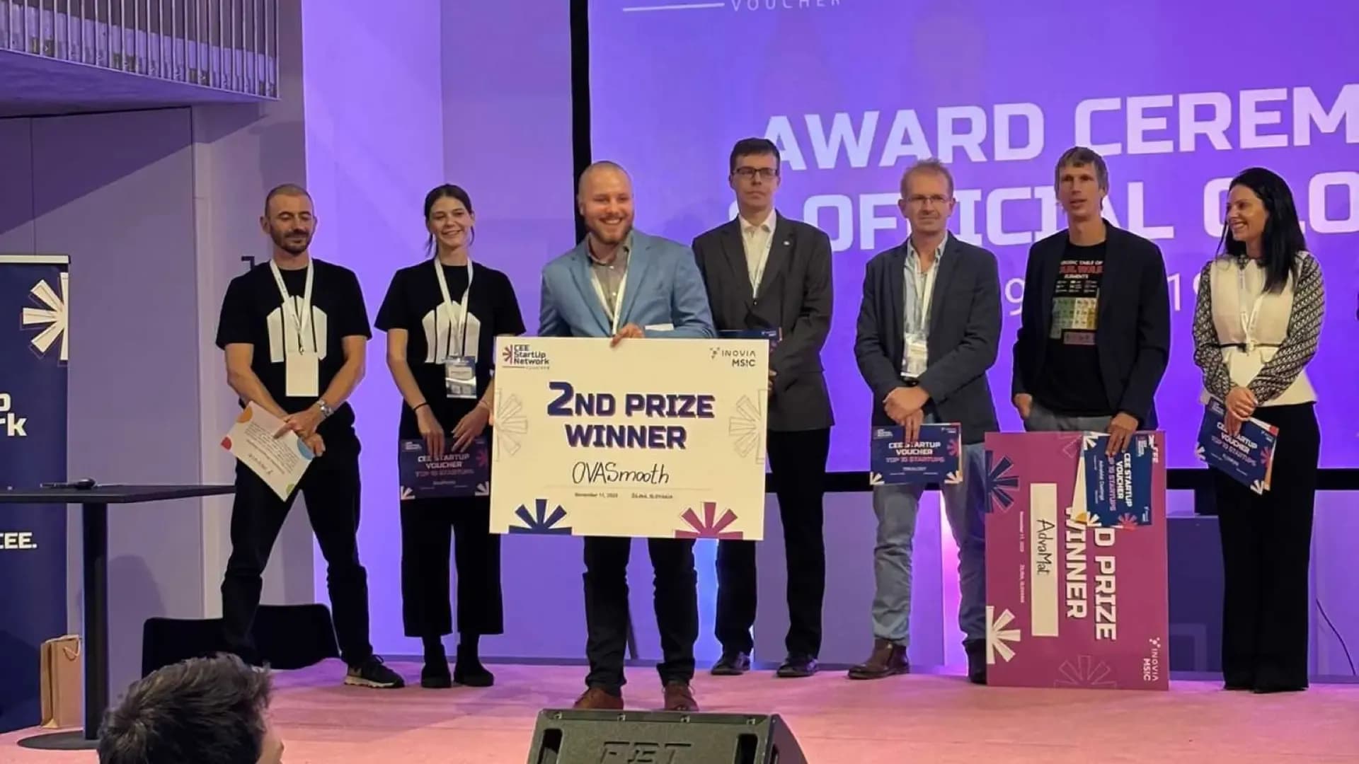 OWASmooth founder holding a second prize award