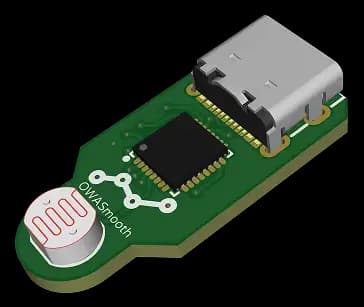 Green printed circuit board with OWASmooth logo, containing microcontroller and a light sensor.